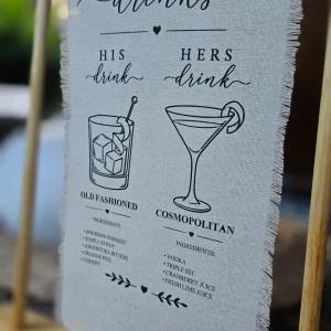 Linen-style wedding bar sign with signature drinks