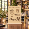 Scalloped wooden signature drink sign with pet portrait displayed on a wedding bar