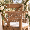 Personalized in memory of wedding sign hanging from a ceremony chair