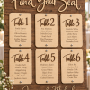 Personalized wood wedding seating chart with engraved guest names and table numbers