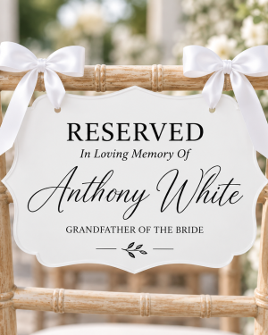White acrylic reserved memorial chair sign with white ribbon for wedding ceremony