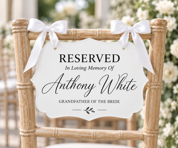ChatGPT Image Sep 22, 2026, 10_18_03 PM White acrylic reserved memorial chair sign with white ribbon for wedding ceremony