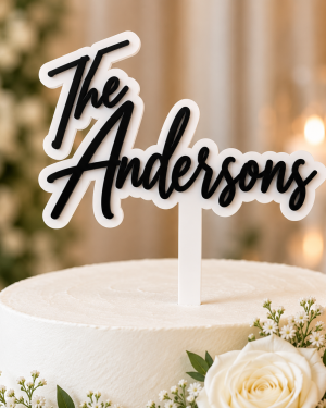 Personalized 3D acrylic wedding cake topper with white base and black last name lettering