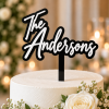 Personalized 3D acrylic wedding cake topper with black base and white last name lettering