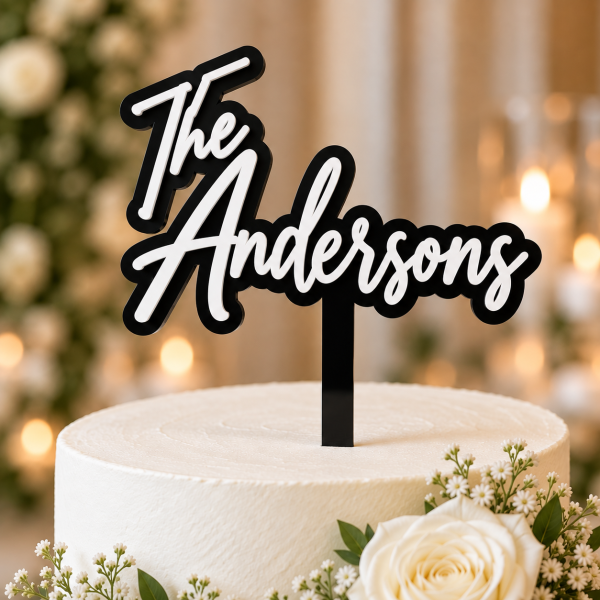 Personalized 3D acrylic wedding cake topper with black base and white last name lettering