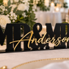 ChatGPT Image Sep 25, 2026, 12_52_31 PM Personalized black acrylic MR and MRS wedding sign with gold mirror last name lettering